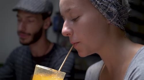 Young Attractive Woman Drinking from Biodegradable Wheat Straw. Environmentally Friendly Plastic Alt