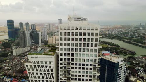 Aerial Drone Urban Highrise with Green Terraces in Cityscape Waterfront Skyscrapers Urban Layout