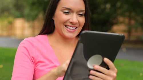 Woman Using Digital Tablet Outdoors 20s