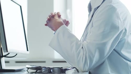Professional Medical Doctor Working in Hospital Office Using Computer Technology Medicine and