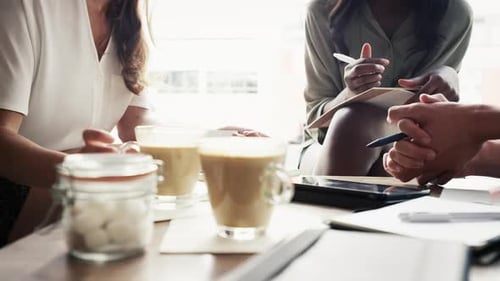 Hands, teamwork and notebook in coffee shop for brainstorming or startup project