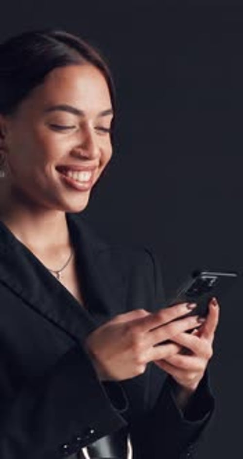 Businesswoman, typing and laughing in studio with phone for social media