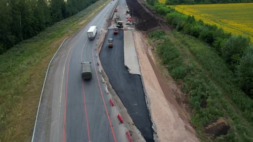 Road Works and Asphalting of Roads Heavy Machinery in the Summer