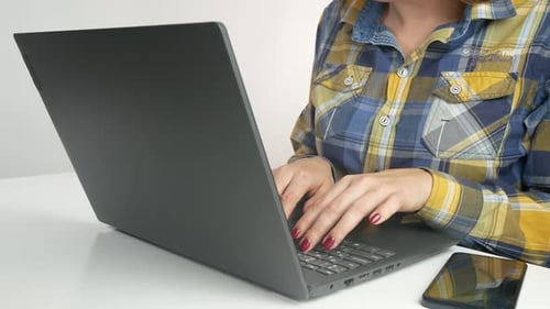 Woman Closing Laptop