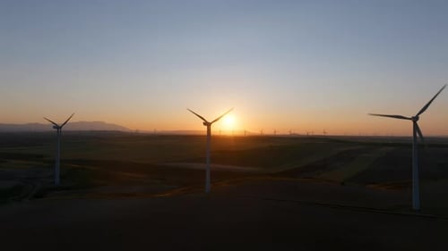 Wind Turbines at Sunset Generating Clean Energy