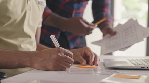 Mobile App Developers Working on UX Project in Office