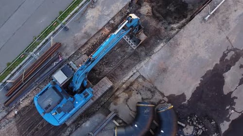 Aerial View of Excavator at Trenching Construction Site