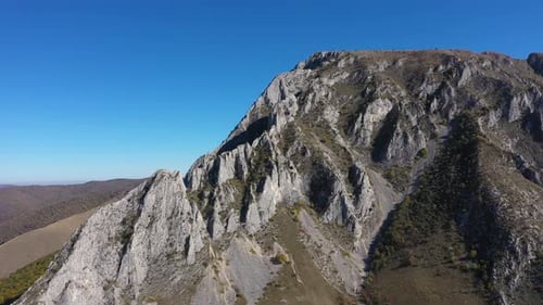 Aerial view of alpine cliffs high mountain. Piatra Secuiului, Szekelyko, Romania by drone