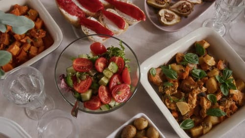 Close-up of Festive Table Set with Roasted Vegetables and Sweet Potatoes