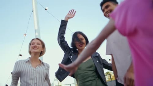 Friends Dancing and Celebrating Together Outdoors