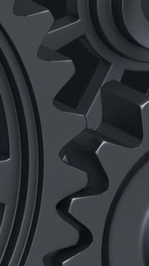 Intricate Array of Rotating Interlocking Metal Gears in CloseUp View