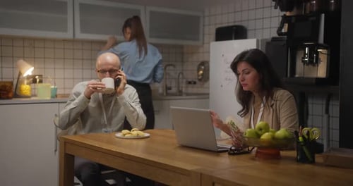 Office Workers Do Their Business in Front of Gadgets During Lunch While Sitting at a Table in the