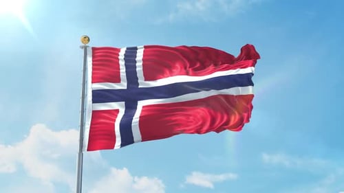 Waving Norwegian Flag Against Bright Blue Sky