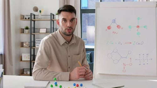 Distance Education School and Video Blogging Concept - Male Chemistry Teacher With