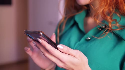 Woman Using Smartphone Indoors, Close Up View