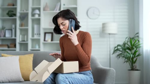 Woman on Phone with Cardboard Box