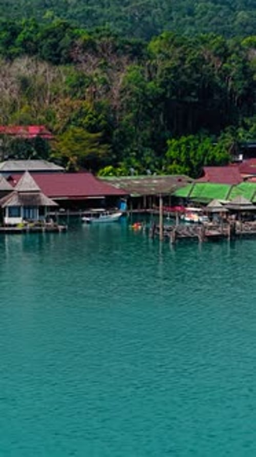 Kayak Near a Picturesque Seaside Village in Calm Waters