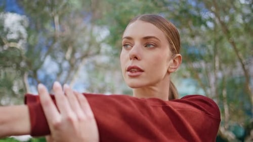 Woman Stretching Arm Outside During Daytime
