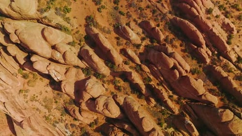 Descending over the rocks diverse in size and shape. Arches canyon in Utah, USA