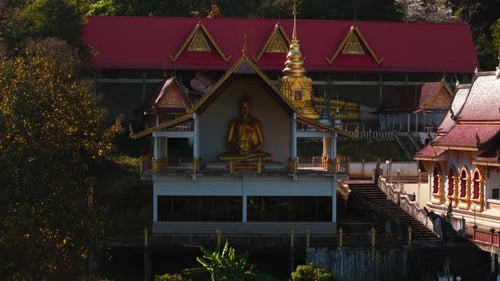 Golden Buddha Statue Sitting in Meditation Pose at Wat Pong Yaeng Nok Buddhist Temple a Beautiful