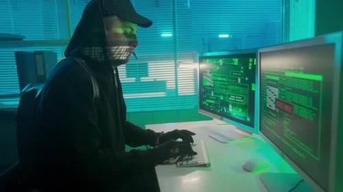 Hacker is Typing on a Computer Keyboard and Cracking a Password