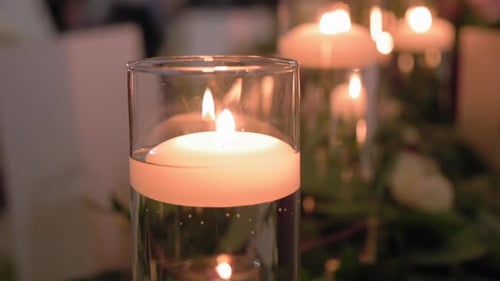 Candles Float in Glass at Wedding Reception