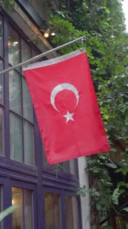 Turkish Flag Waving on Building Side