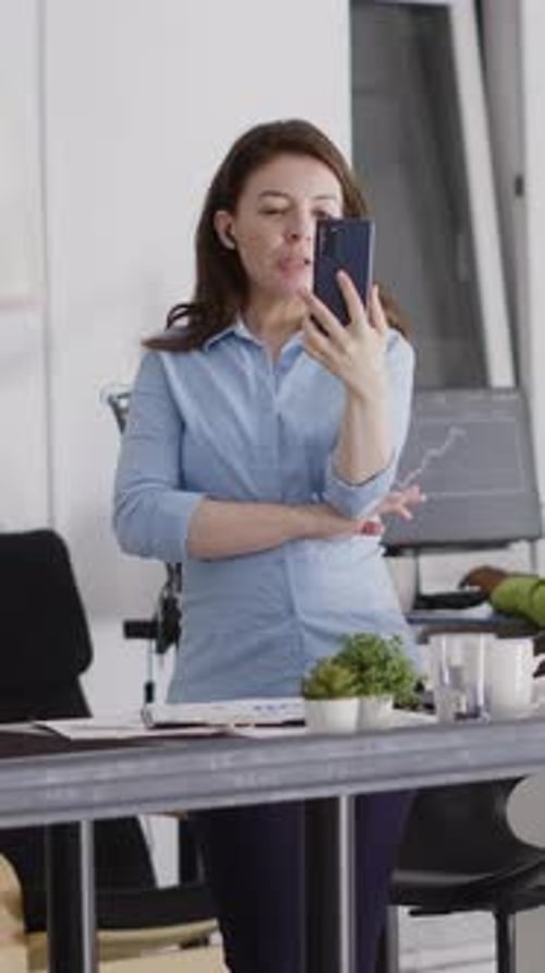 Vertical Video Agency Employee Using Videocall Meeting on Smartphone