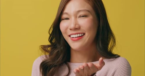 Smiling Woman Posing on Yellow Background
