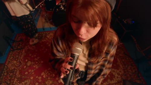 Portrait of Lead Singer in Band, Performing Live in Punk Band in Music Studio