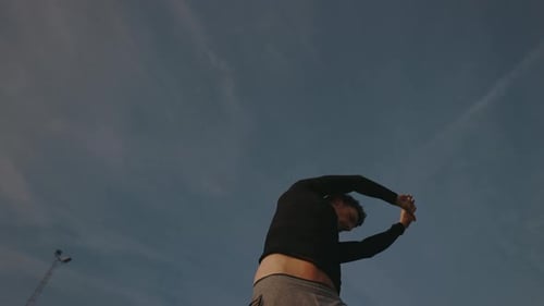 Morning Training Of Young Athlete In Park Man Does Physical Exercises For His Hands