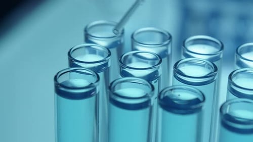 Liquid Being Dropped into Test Tube for Experiment