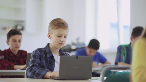 Students are Actively Engaged in Modern Classroom Learning Environments Equipped with Laptops