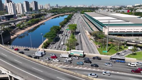 Cityscape of rush traffic jam at freeway road. Transportation scenery.