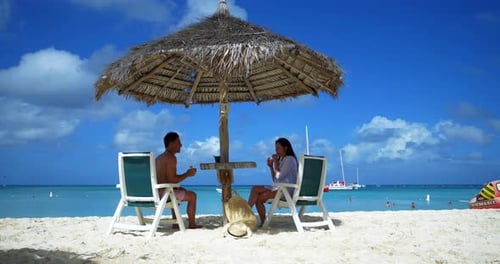 Aruba Couple Enjoying Tropical Beach Drinks