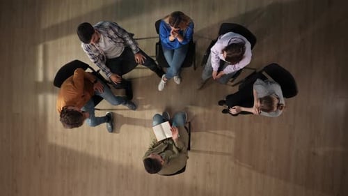 Group Meeting from Above on Wooden Floor