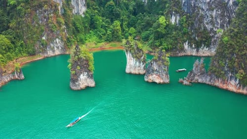 Three limestone rocks Three Brothers at Cheow Lan Lake, Khao Sok National Park, Surat Thani Province