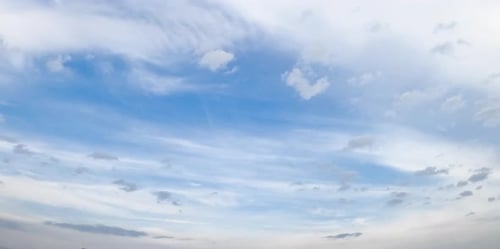 Cirrus and cumulus clouds moving in the sky. Beautiful horizon from low angle view. Timelapse.