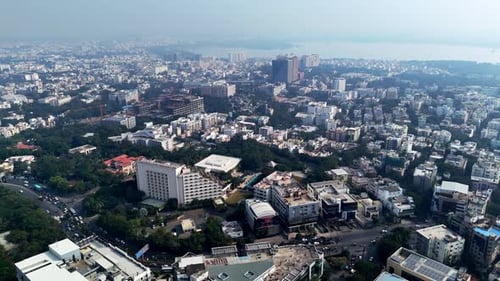 Aerial view of Hyderabad showcasing dense urban development, mid-rise buildings, and green spaces