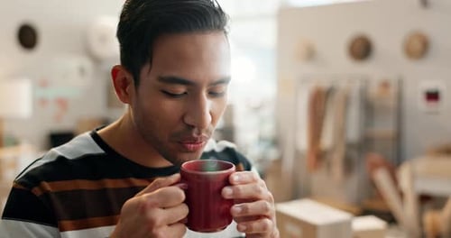 Coffee, relax and a man designer in his workshop for creative shipping, delivery or distribution