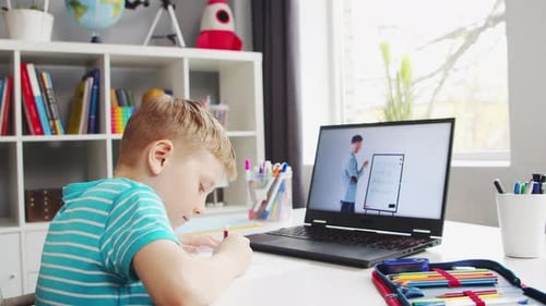 Boy Studying Online During Laptop Lesson at Home