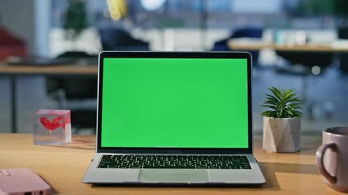 Modern Green Screen Laptop Displayed on Work Desk Closeup Chroma Key Computer