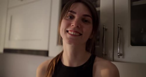Smiling Woman Close-Up in Kitchen