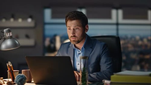 Office Worker Chatting Video Conference Using Laptop at Night Office Closeup