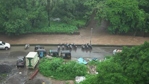 river is over flowing flood in Mumbai India Kashimira green village in rain