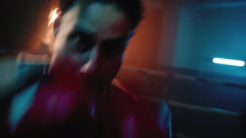 Boxer Training in a Boxing Ring at Night