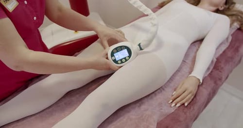 Professional Conducting Lymphatic Drainage Therapy in Spa Setting