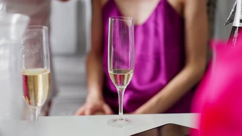 Bride Ready for Her Big Day with Champagne and Anticipation