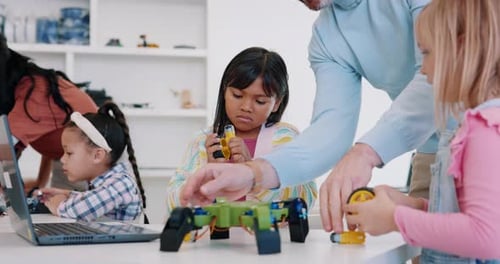 Science, robotics and children building a drone in class for education, growth