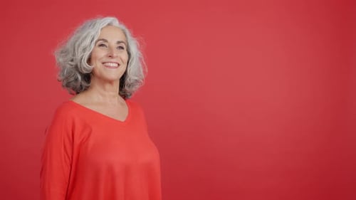 Senior Woman Receiving a Gift with Joy